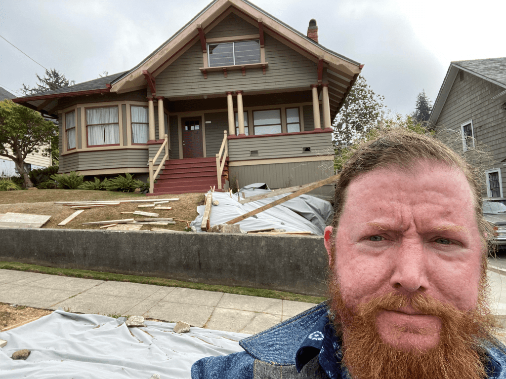 A picture of me in front of the real-world house that served as reference